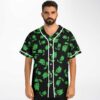 Front-facing model wears a black repeating green creature pattern with contrasting white trim