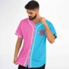 Split pink-and-cyan slogan jersey modeled from an angled front view at a festival