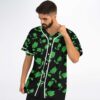 Model wears black repeating green creature pattern with white piping, angled front view
