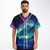 Model wears an aurora borealis mountain-and-ocean pattern with white piping and two distressed face symbols