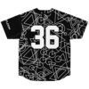 Black jersey featuring all-over white geometric circle and triangle pattern, back view with bold 36