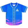 Royal blue geometric emblem jersey front with white piping, buttons, stars, and purple-pink cloud border