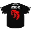 Black jersey featuring red dual-mask graphic and geometric white lettering, flat back view on white