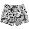 Psychedelic doodle collage swim trunks, back view with surreal shapes, leaves, creatures, and bold linework
