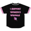Black jersey back with pink “I SUPPORT WOMEN’S WRONGS” lettering and lips holding lollipop
