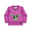 Cartoon-style green creature on a magenta tonal pattern jersey, front view with lace-up collar