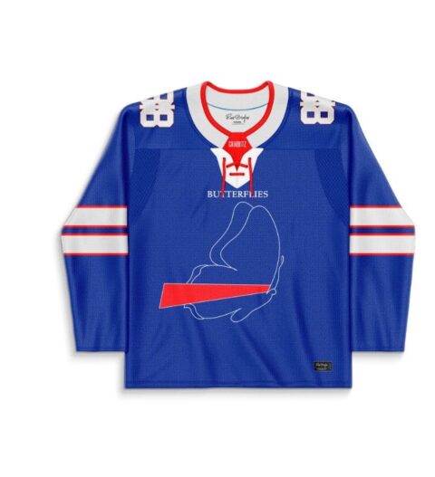 Royal blue line-art rave jersey front with red accents, white stripes, and butterfly-themed center graphic