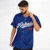 Royal blue script sports lettering with red 34, worn model front view showing button placket