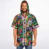 Model wearing colorful mushroom and eye collage hooded jersey, front view with VIBE CHECK text