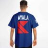 Royal blue geometric back graphic with white AYALA lettering, worn model back view in studio
