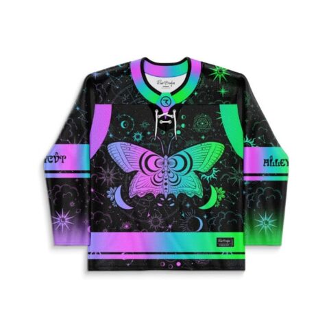 Neon butterfly and celestial swirl pattern on a black jersey, front view with rainbow trim