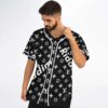 Model adjusting black floral monogram-style jersey featuring white Ridim lettering, front three-quarter studio view