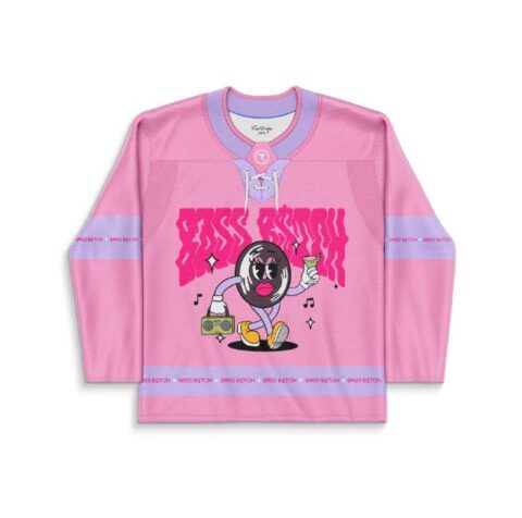 Pink cartoon-style mascot graphic with lavender trim and music motifs, festival hockey jersey front view
