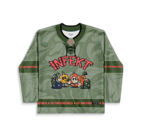 Sage vegetable swirl jersey front with cartoon vegetables and “EAT YOUR VEGETABLES” text, flat view