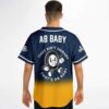 Navy-to-gold gradient jersey with walking cartoon-style character and “AB BABY” slogan, worn back view