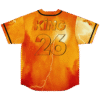 Orange lightning jersey back view with bold KING 26 lettering and fiery storm pattern