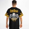Black-and-gold triple-skull skeleton graphic and bold lettering shown on a model, back view