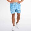 Sky blue cloud-like tie-dye swim trunks modeled with white sneakers, front festival styling