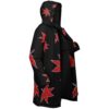 Open-front black cloak with scattered red maple leaf pattern, showing hood and inner lining