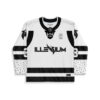 Black-and-white clean winged-logo jersey front view with captain C, bold stripes, and patterned cuffs
