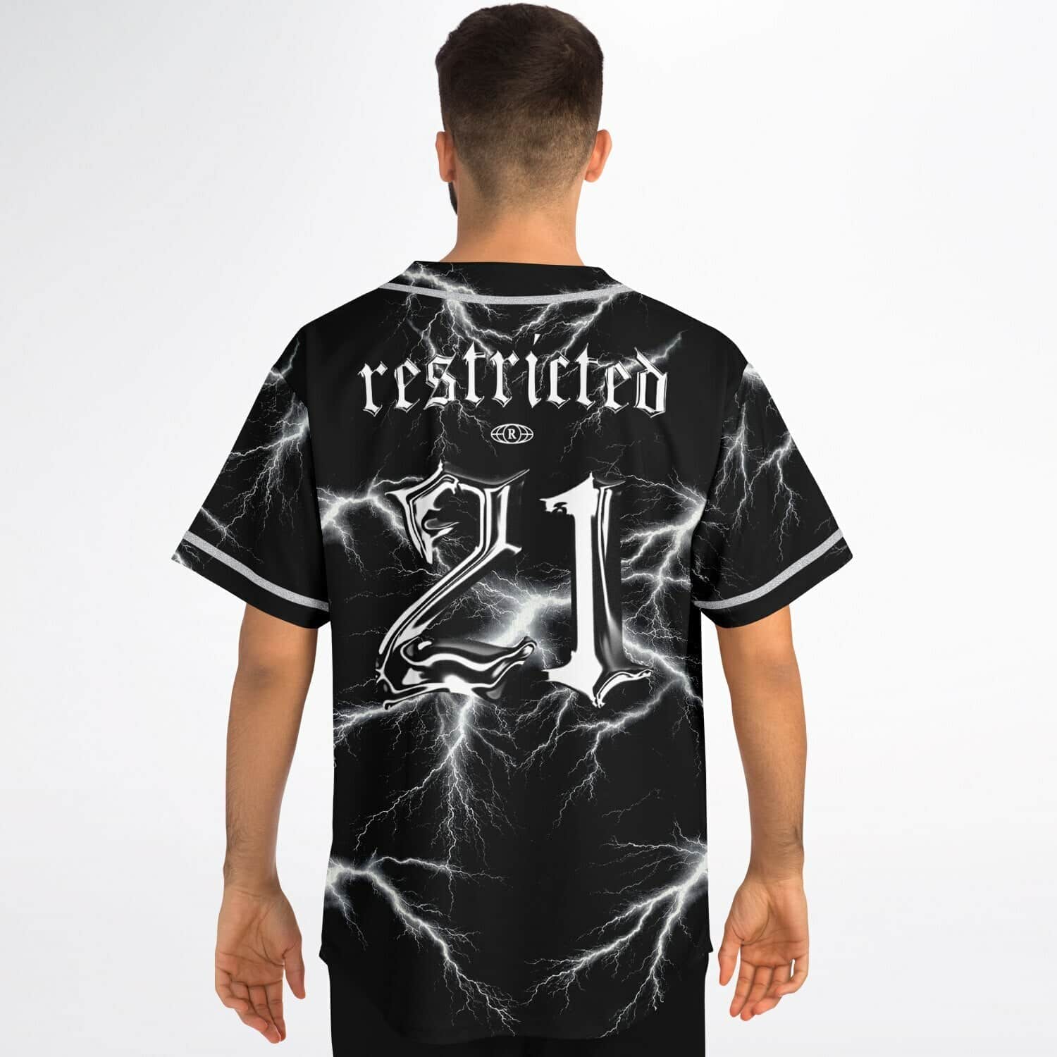 Model wearing electric lightning-pattern jersey back view with โrestrictedโ text and 21 graphic in studio