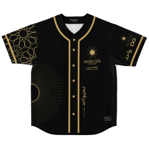Black-and-gold Moroccan geometric jersey front with sun motifs and Arabic lettering, studio product view