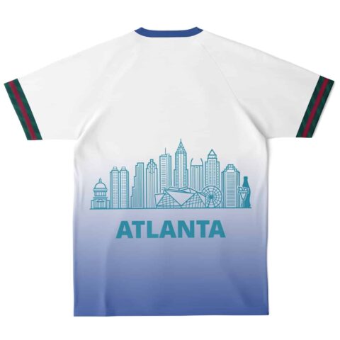 Back view of soccer jersey featuring skyline design and teal lettering
