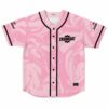 Pink liquid marble jersey front shows black piping, button closure, and small gear-style chest emblem