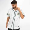 White front jersey with green dinosaur “YOSHI” emblem and repeating sleeve figures, modeled festival view