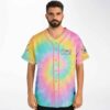 Pastel rainbow spiral tie-dye jersey with pink piping, modeled in a straight-on front view