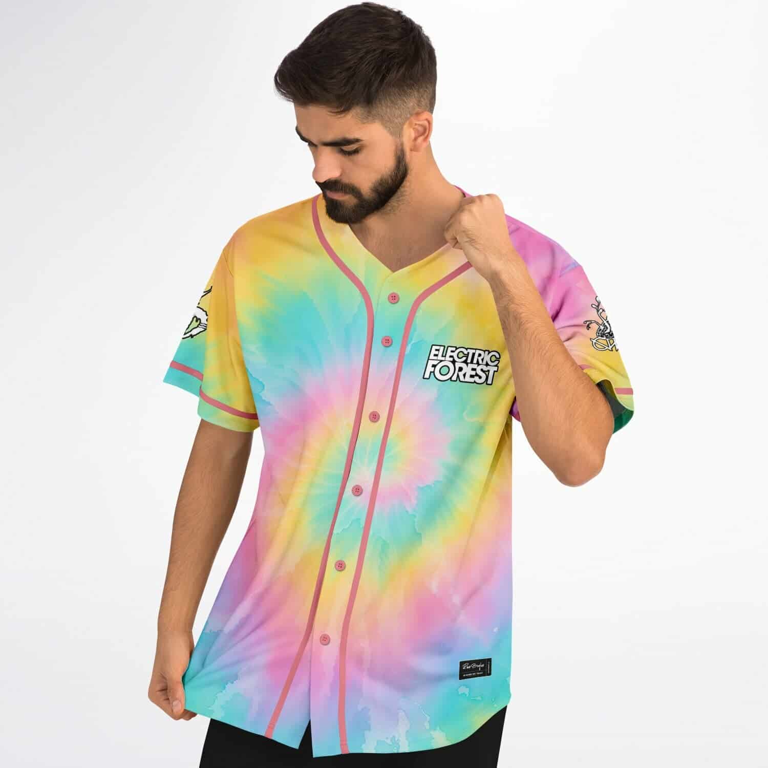 Pastel rainbow spiral tie-dye jersey with pink trim, shown in a modeled three-quarter front view