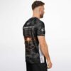 Side view of model in black camo rave soccer jersey with colorful panel accent