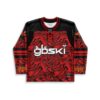 Red-black abstract swirl jersey front with bold white lettering and striped sleeves, studio view