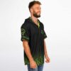 Profile of a smiling man in the black rave hooded baseball jersey with bright neon details