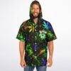 Model wearing cosmic cannabis galaxy front with neon leaves, hood, white buttons, and short sleeves