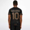 Model wearing black and gold rave soccer jersey with custom name and number, model back view