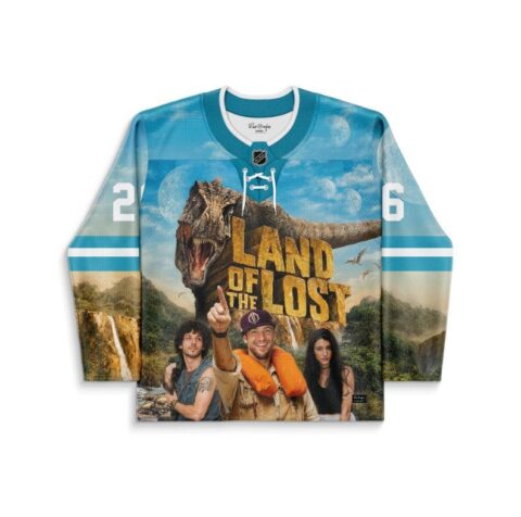 Sky blue dinosaur jersey with roaring T. rex, LAND OF THE LOST lettering, front view