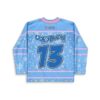 Blue snowflake-pattern jersey with pastel stars, pink trim, and bold number 13, back view