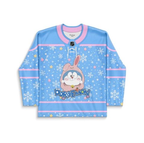 Blue anime-inspired jersey with bunny-hooded cartoon cat, snowflakes, pastel stars, and pink trim, front view