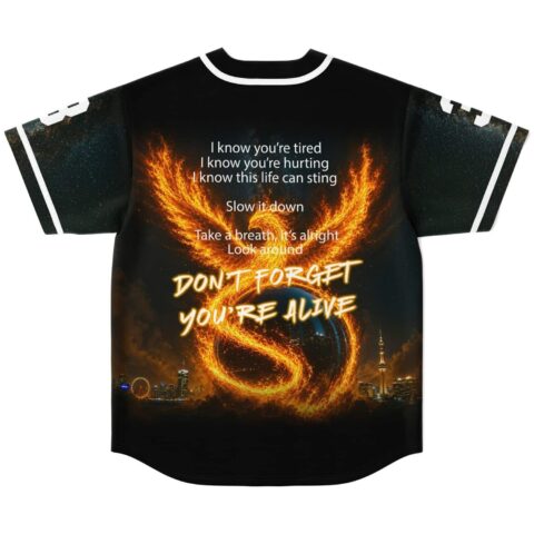 Flaming phoenix back view with “DON’T FORGET YOU’RE ALIVE” over a glowing city skyline