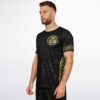 Chest crest medallion and gold chevron side stripe on black rave soccer jersey, front view