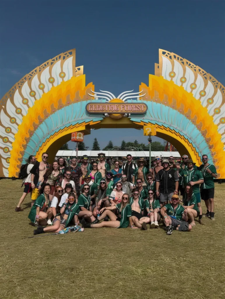 Big rave crew in matching custom green jerseys at Electric Forest