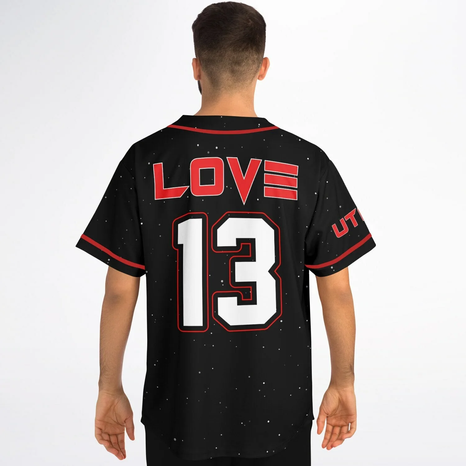 Model wearing black galaxy print baseball jersey with LOVE 13 back design and red piping