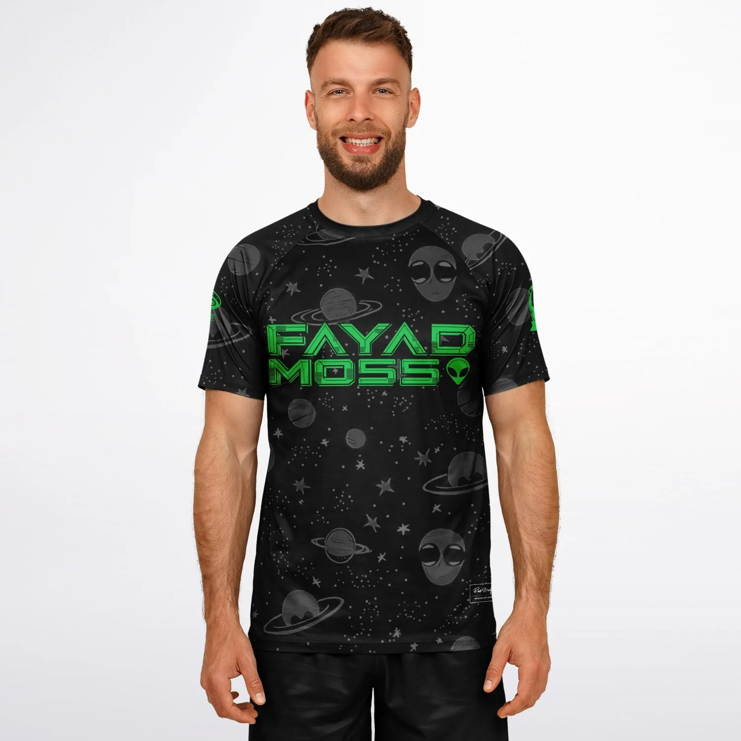 Model wearing black galaxy print soccer jersey with planets, stars and alien graphics