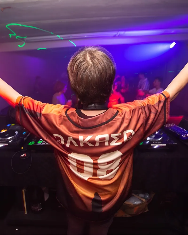 Dakred wearing a custom Rave Bonfire jersey