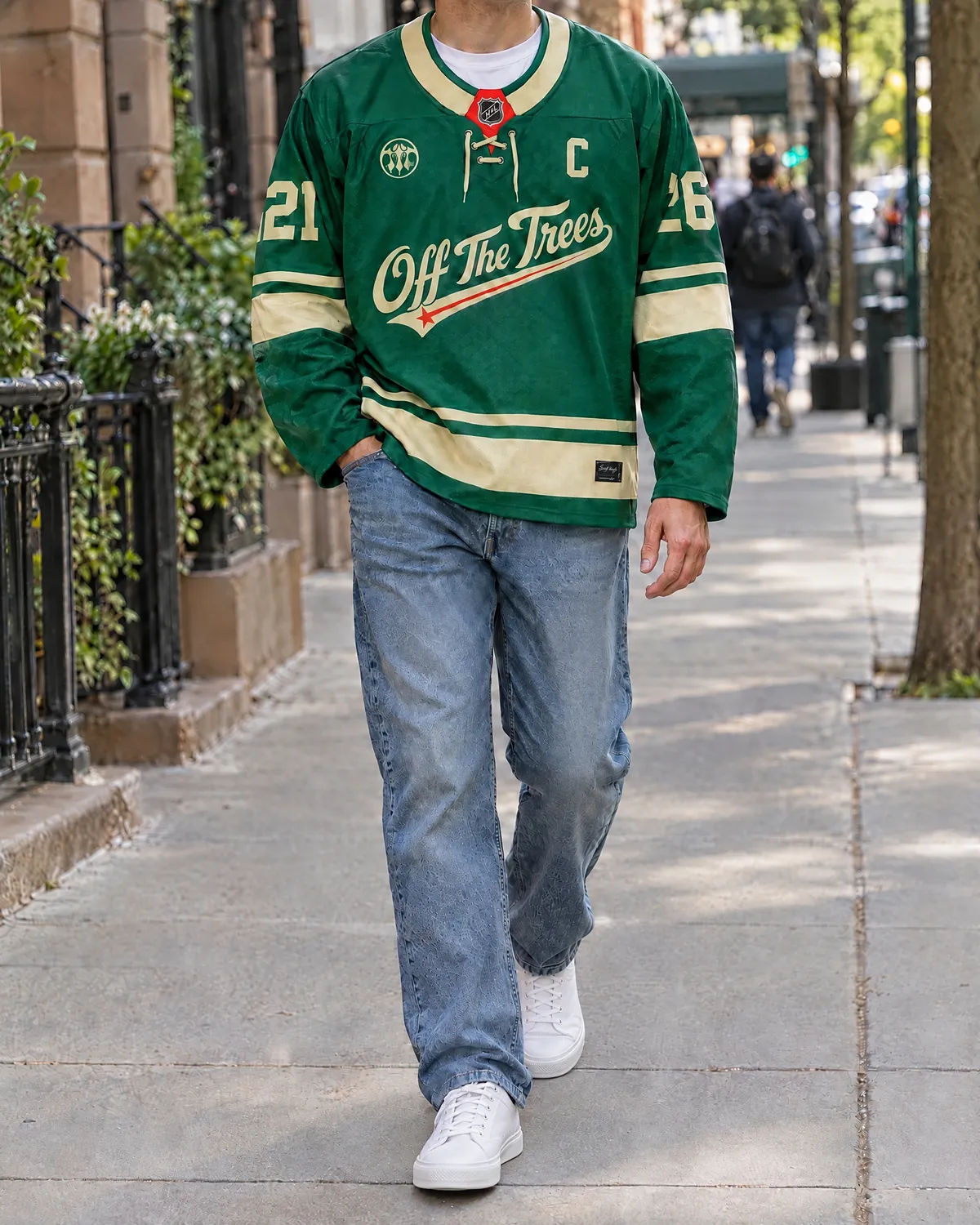 Forest green hockey jersey over a white tee with straight jeans and white sneakers.