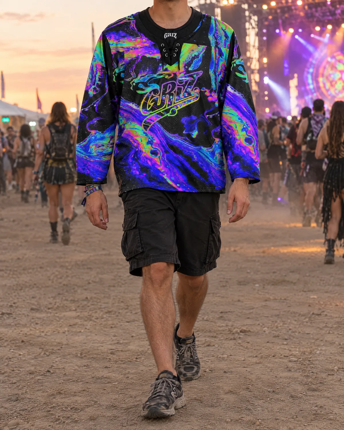 Neon psychedelic GRiZ hockey jersey with black cargo shorts and running sneakers at a festival.
