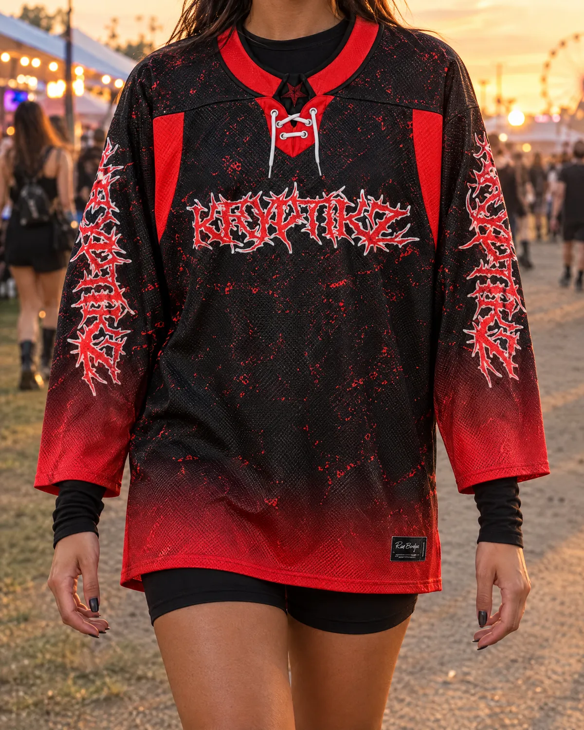 Black and red gothic hockey jersey layered over a fitted black long-sleeve top and bike shorts.