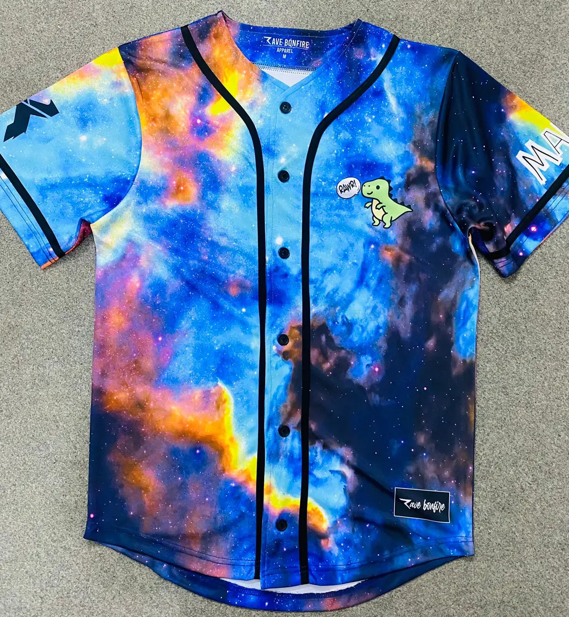 Front of a sublimated baseball jersey with an all-over galaxy print and a printed Rave Bonfire neck label
