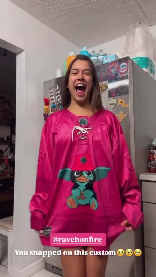Customer reacting to her pink custom hockey jersey